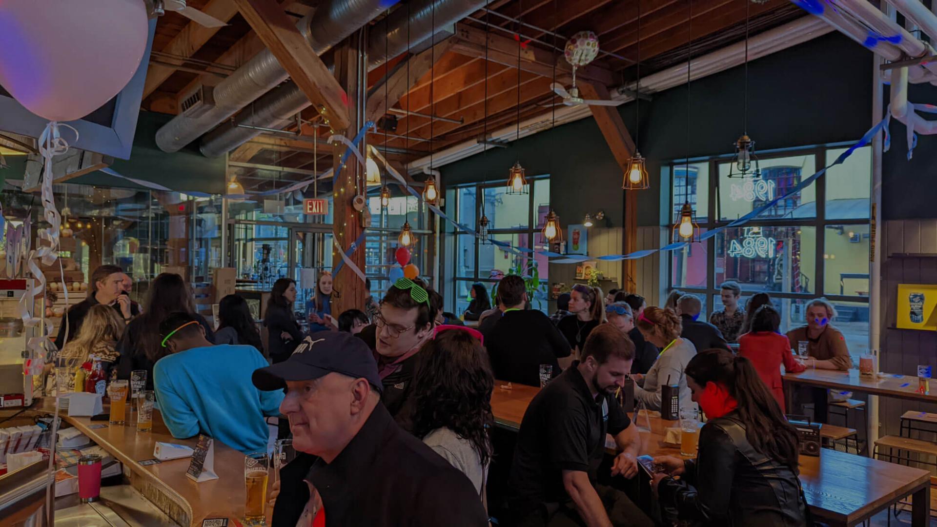 people seated at a table in the Granville brewery