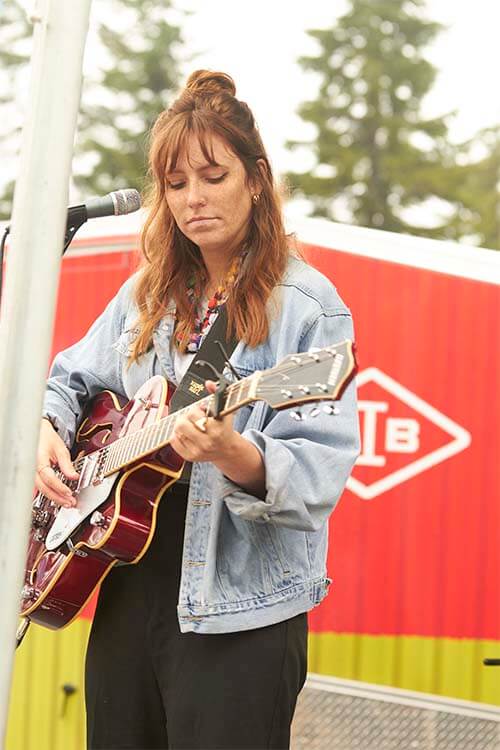 girl play a guitar