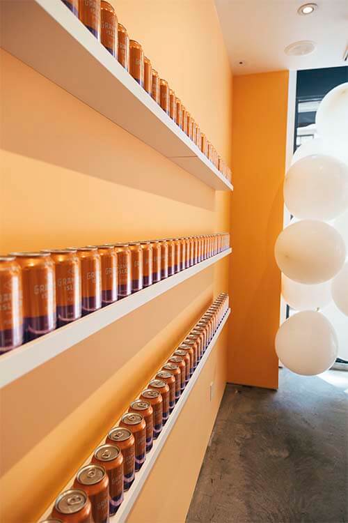 wall with granville cans in stand