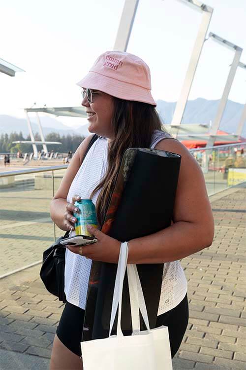 girl chatting with a granville can in a hand