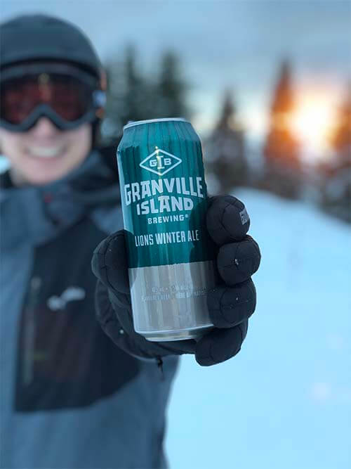 person smile with a granville can on snow