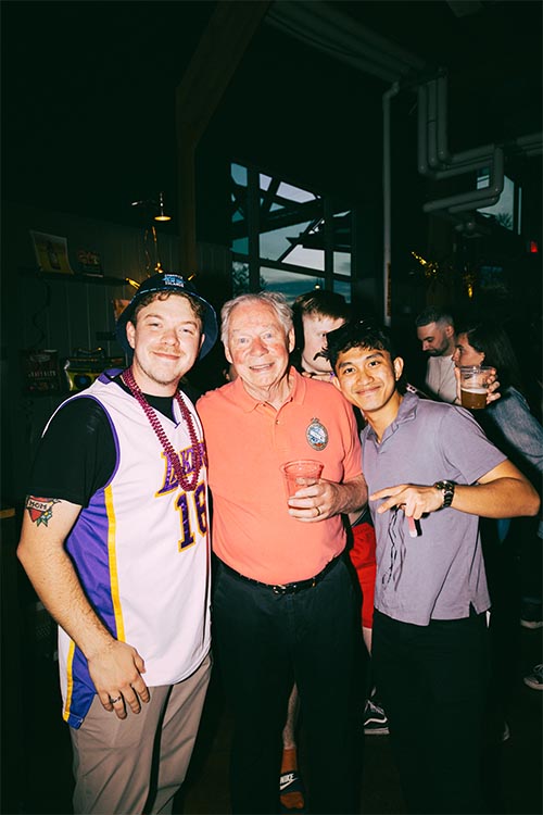 persons smiling and posing for photo