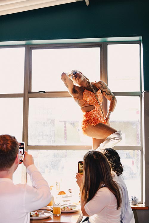 drag queen posing for photo in a granville brewery party