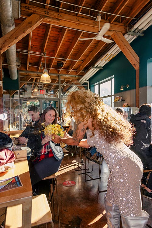 giving flowers in Granville store