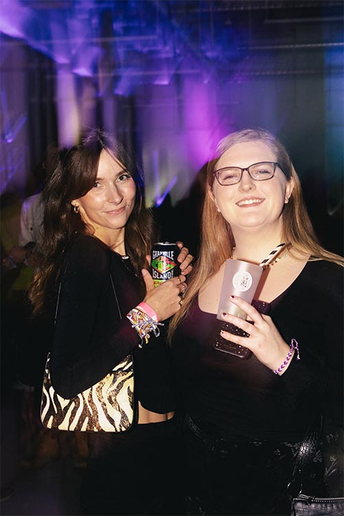 girl posing for photo with granville beers in hands
