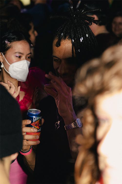 girl with medical mask with a granville can in a hand