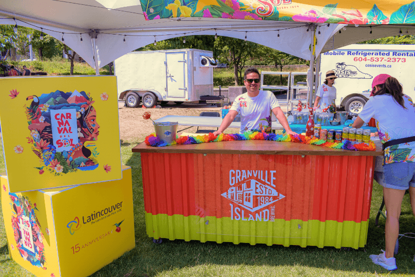 person attending granville beer booth