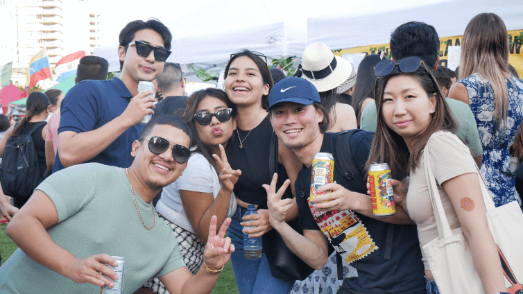 people posing for photo with granville cans in their hands