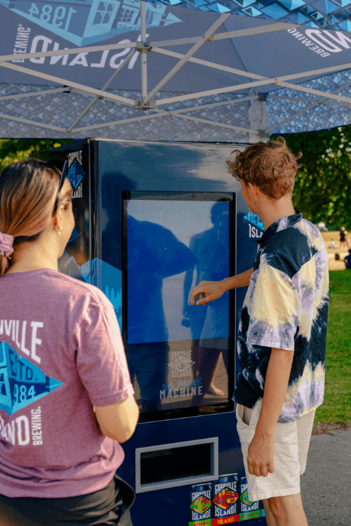 person playing on granville touch screen