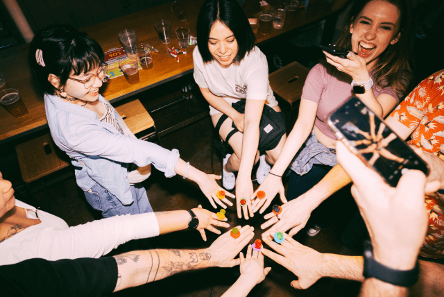 people posing with their candy rings 