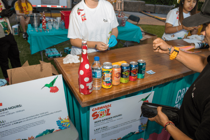 person sell granville cans in a stand